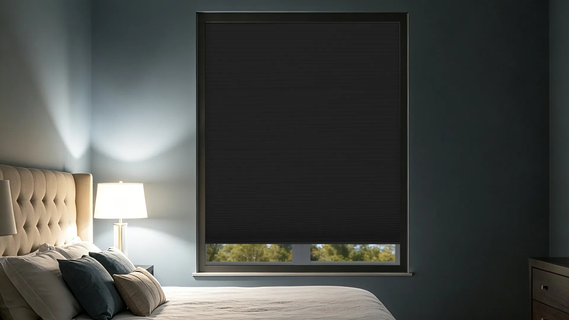 Kurlax blackout cellular shades providing total darkness and quiet in a modern master bedroom.