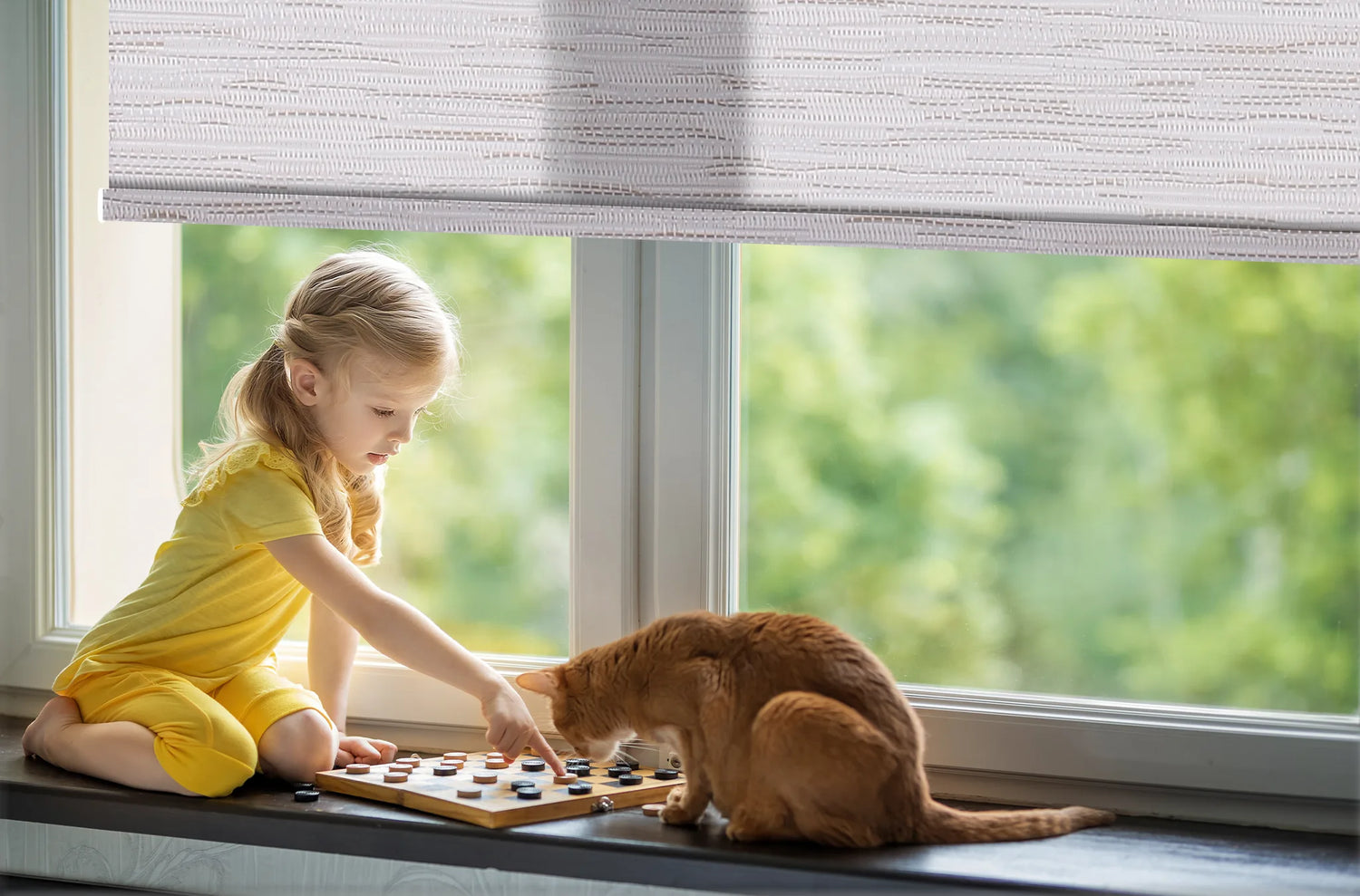Child-safe cordless blackout roller shades in a quiet nursery, featuring ultra-quiet motorized operation under 48dB for undisturbed sleep.