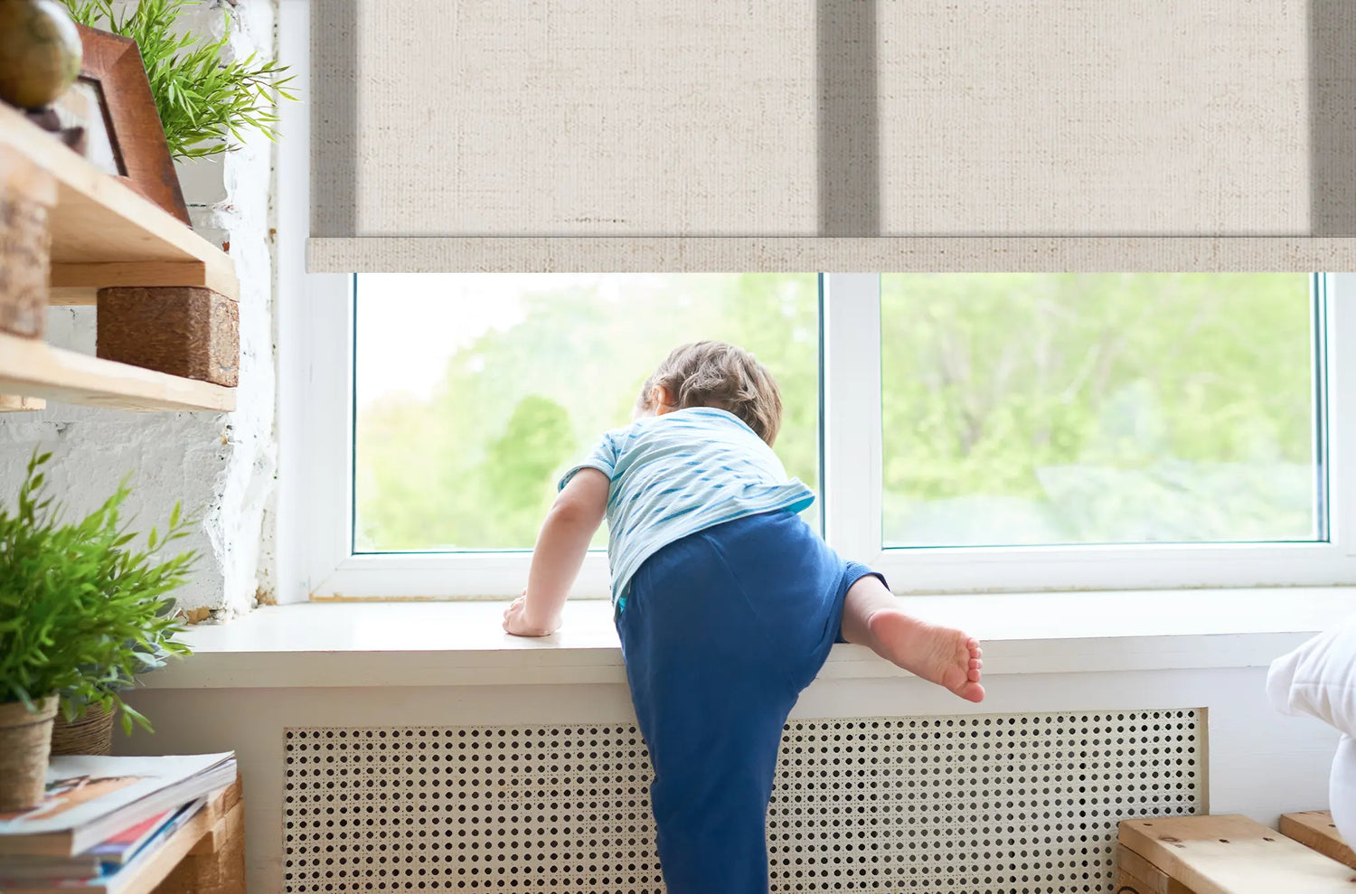 A toddler playing safely near a window with cordless linen texture roller shades in a bright nursery.