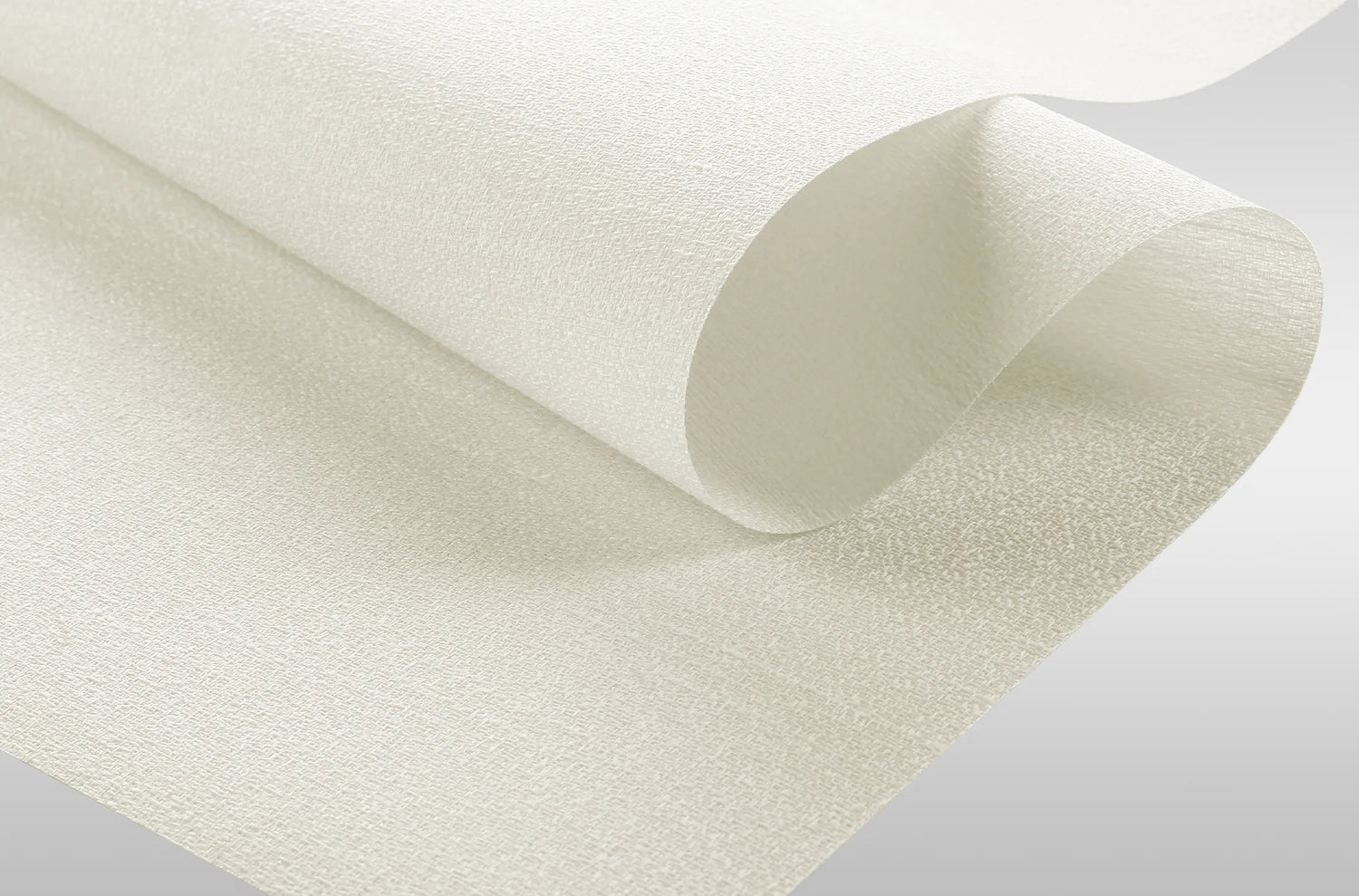 Close-up texture of Kurlax blackout flame-retardant fabric for motorized window shades.