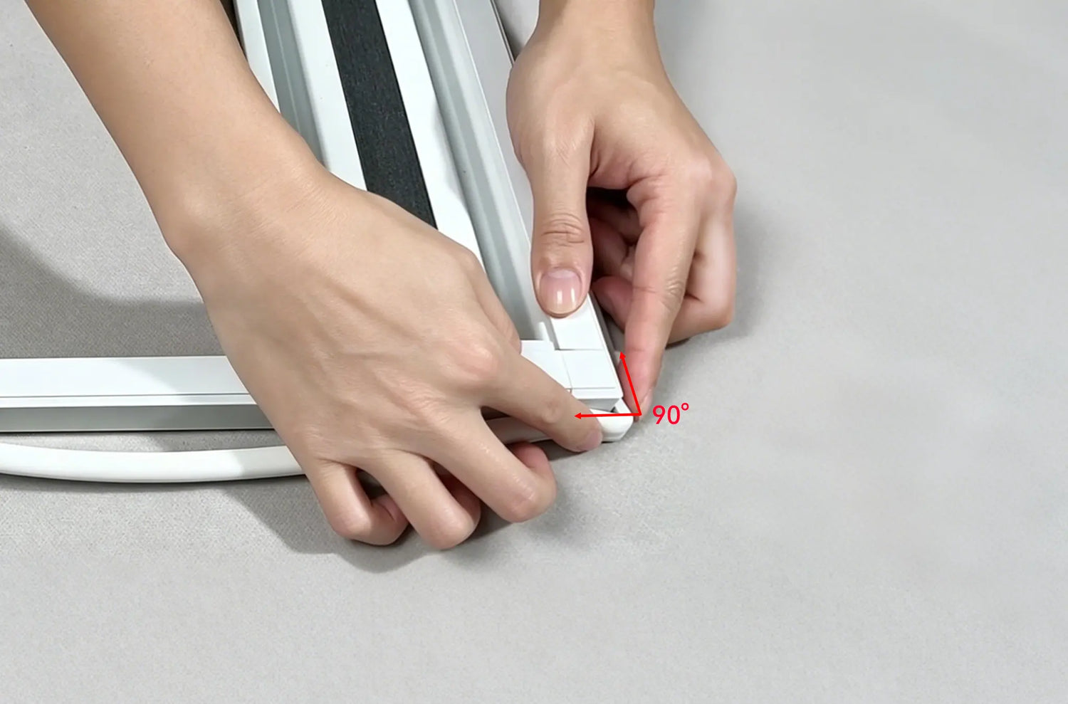 Applying sealing strips to the frame edges, ensuring a relaxed fit at the corners to prevent light leaks.