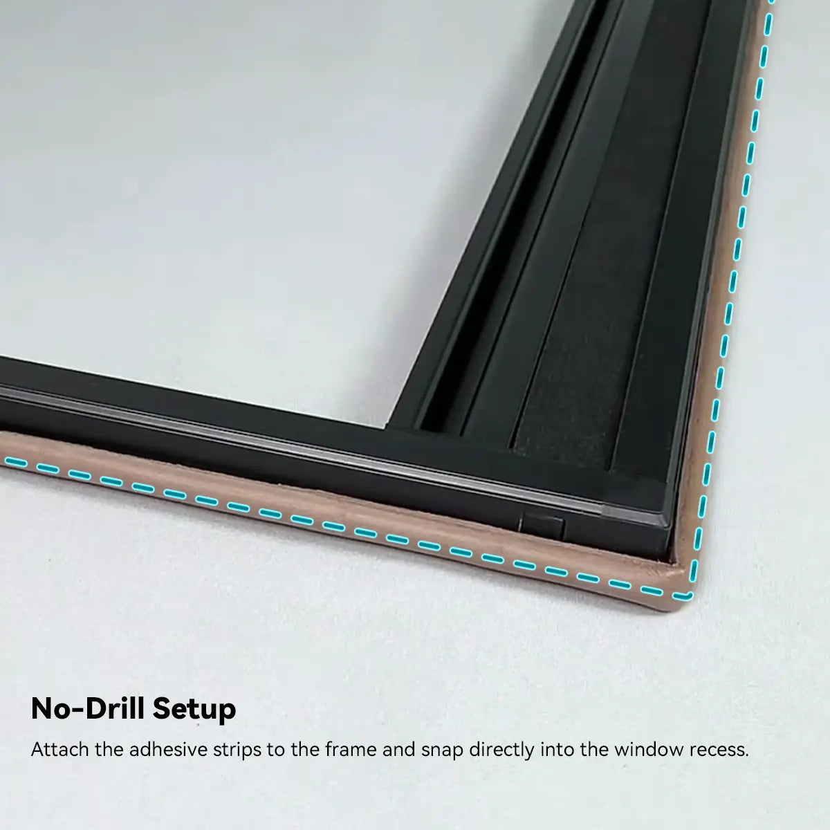A person easily snapping a Kurlax Sleep-Guard blind into a window frame without tools.
