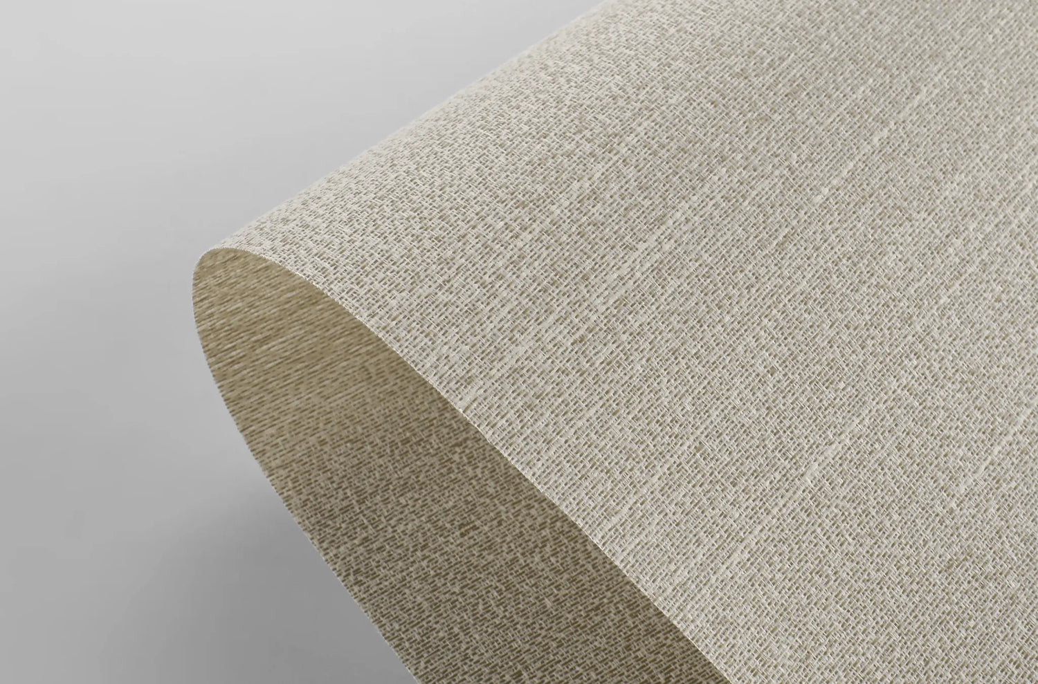 Close-up texture of Kurlax blackout flame-retardant fabric for motorized window shades.