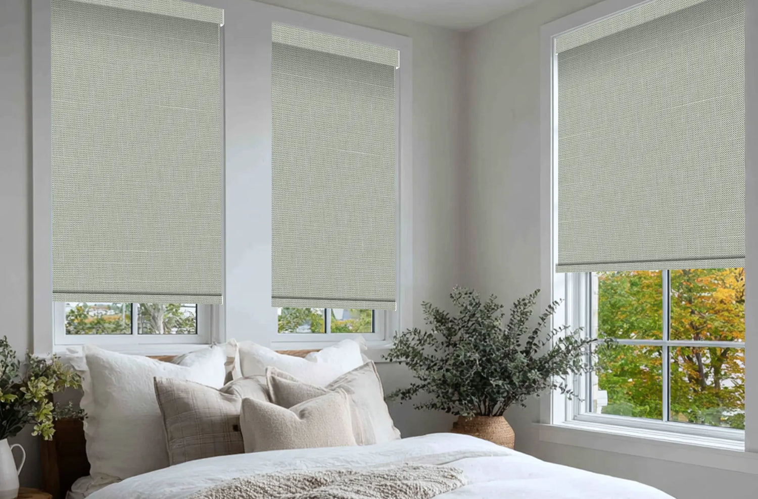 Modern bedroom featuring Kurlax grey blackout roller shades for complete privacy.