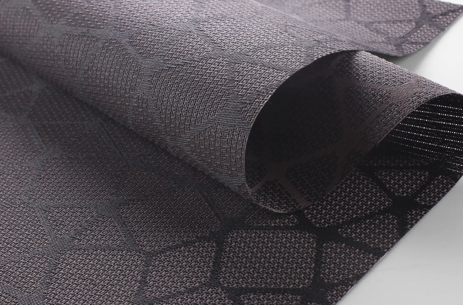 Close-up of Kurlax Geo-Shield solar screen fabric with 3% openness geometric pattern.