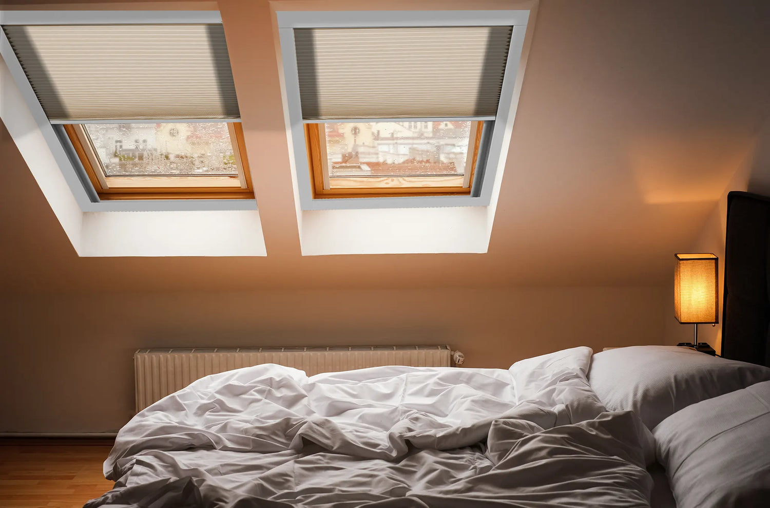 Motorized light filtering skylight shades installed on an inclined bedroom skylight