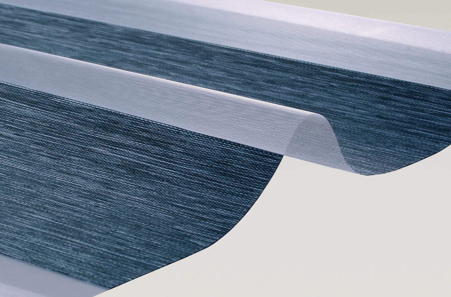 Close-up detail of Kurlax Linen-Luxe 100% blackout zebra shade fabric showing fine linen texture.