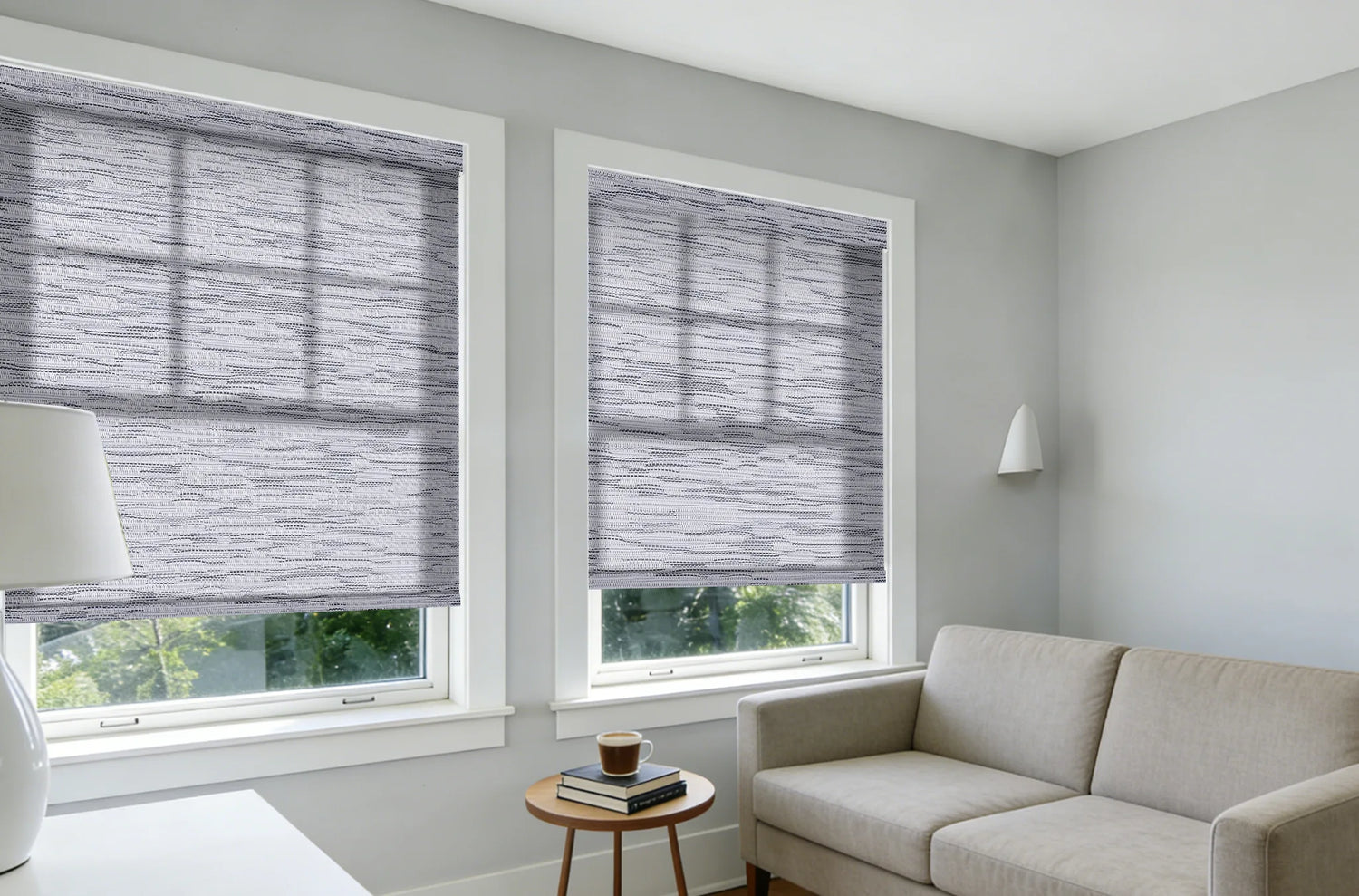 Custom linen jacquard roller shades in a modern living room with soft filtered sunlight