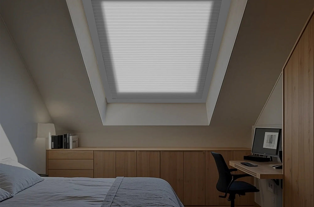 Fully closed motorized skylight shades 60 percent blackout on bedroom inclined skylight