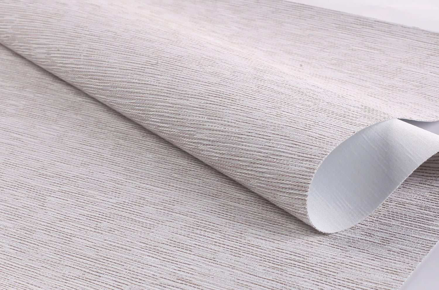 Close-up detail of Kurlax Nano-Shield 100% blackout jacquard fabric in Slate Gray.