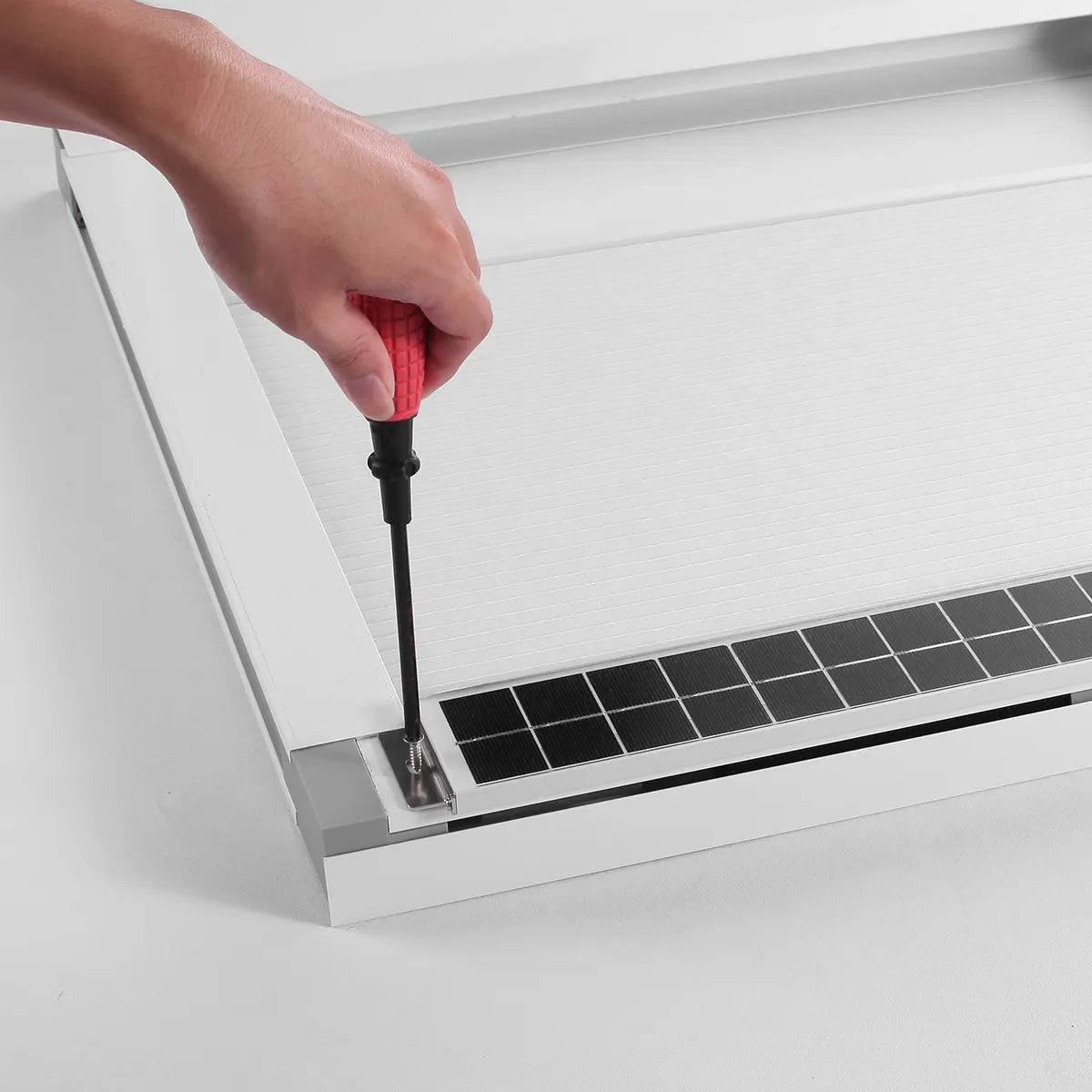 Small solar panel mounted on the window frame to power Kurlax blinds.