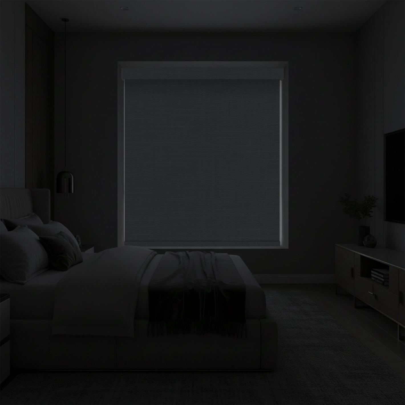 Bedroom showing full blackout effect with motorized blackout roller shades