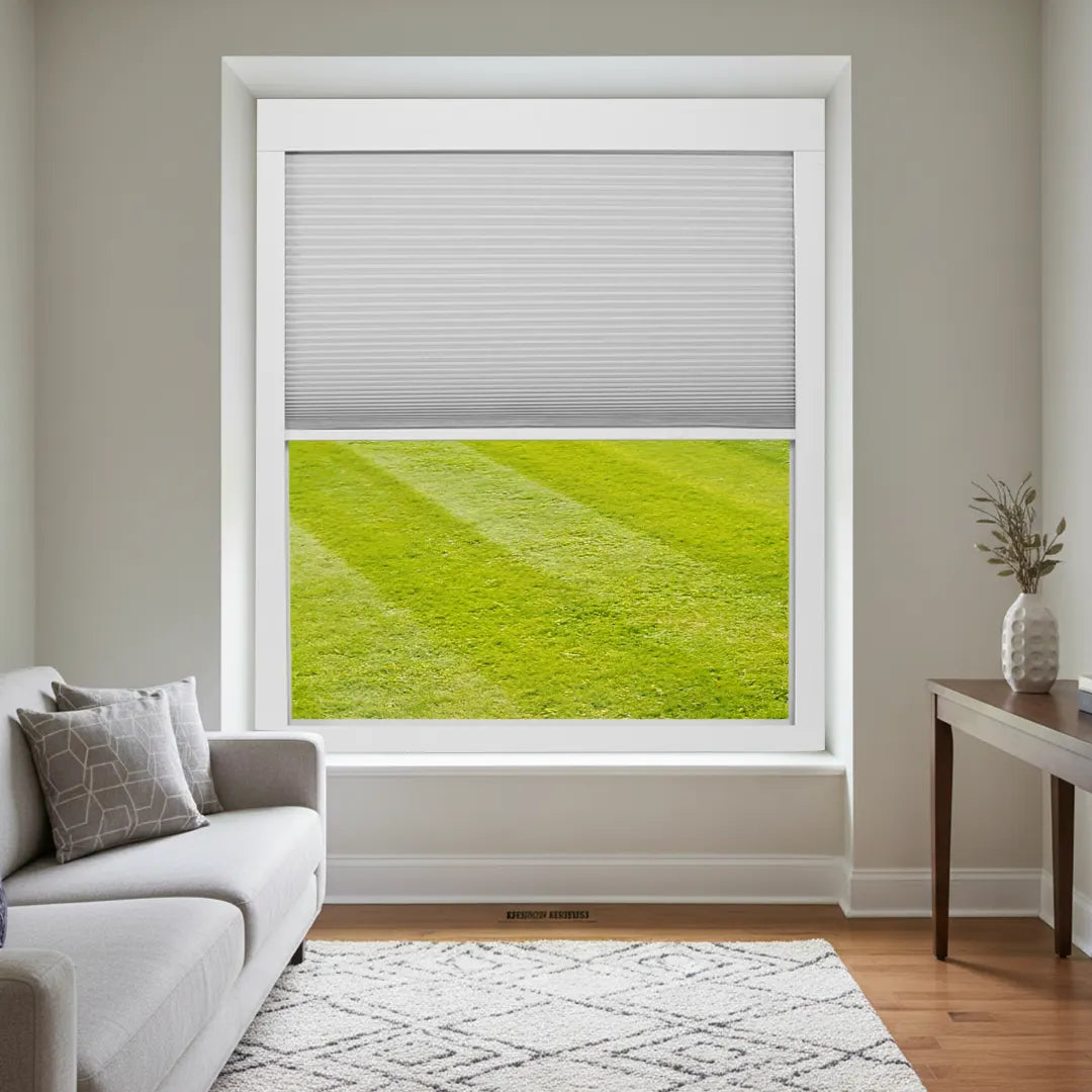 Motorized skylight shade installed on a standard vertical window with full-frame blackout performance.