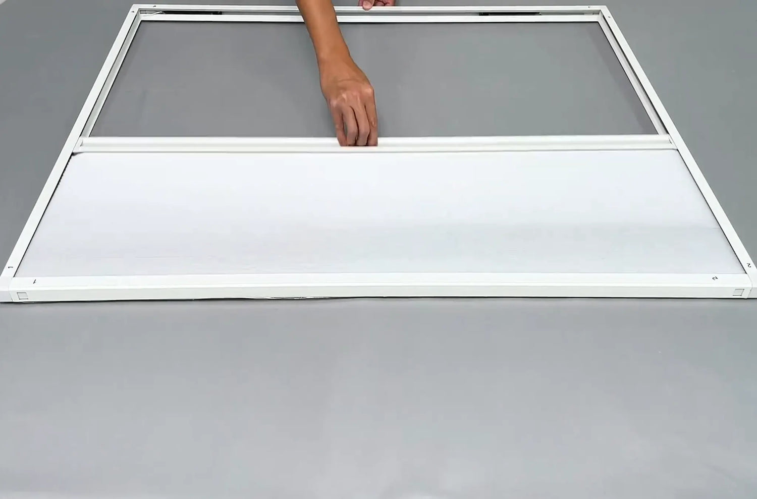 Testing the movement of the assembled Sleep-Guard cellular shade.