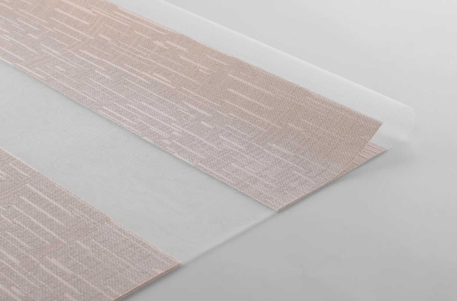 Close-up of Kurlax 70% blackout light-filtering jacquard fabric showing velvet-like texture and weave.